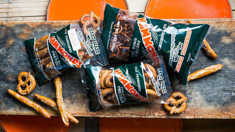 Three of Hammond’s most popular bagged sourdough pretzels on one of our wooden baking boards. Handmade pretzels and pretzel rods that are larger than standard snack pretzels because they’re hand-rolled.